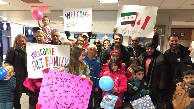 Scenes like this became familiar in Nova Scotia in 2016. Here, the Beechville-Lakeside-Timerberlea refugee sponsorship group welcome the Ali family after a long journey from Syria. (Elizabeth Chiu/CBC) 