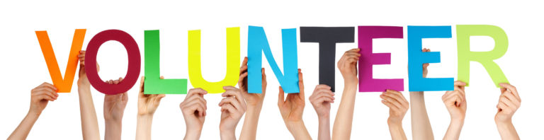 Many Caucasian People And Hands Holding Colorful Straight Letters Or Characters Building The Isolated English Word Volunteer On White Background