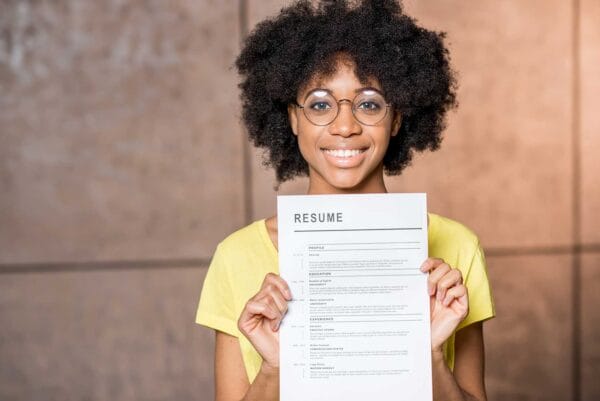 A newcomer woman holding her resume