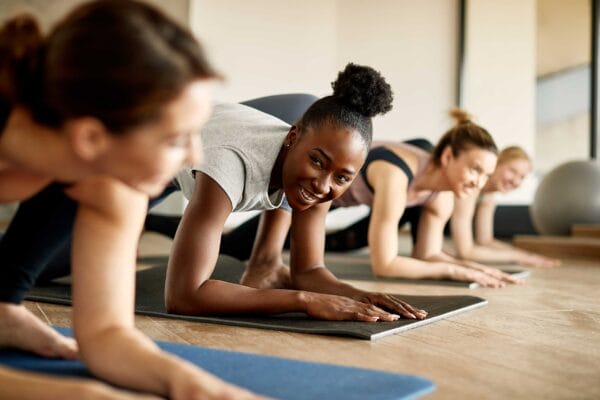 Multiethnic group of women enjoying yoga together