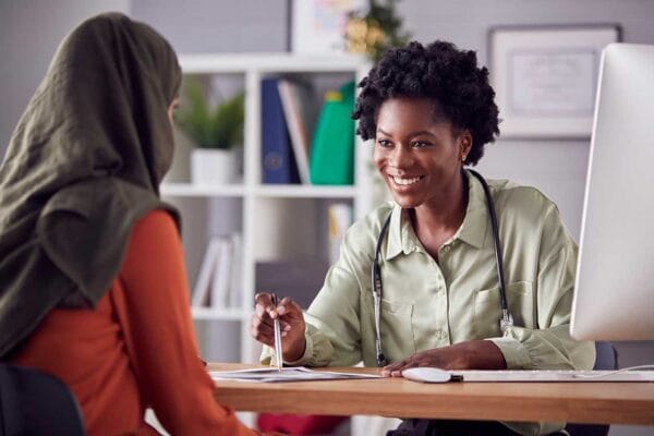 A newcomer female doctor talking to a patient