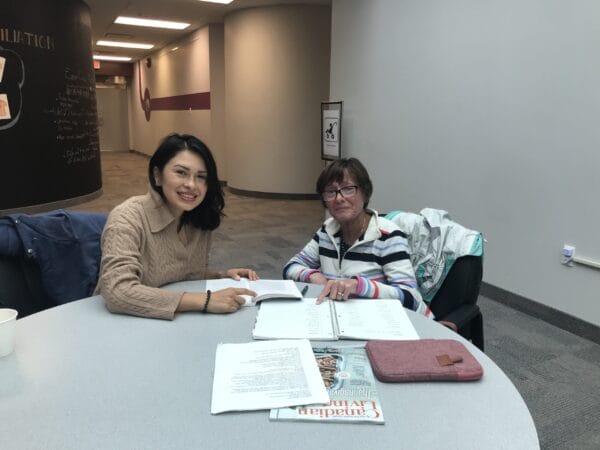 EAL Volunteer tutor with a client