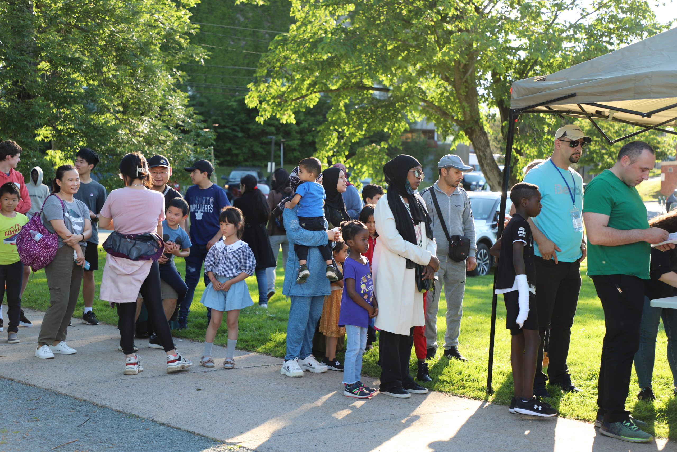 Attending newcomers lined up to get their tickets and snacks for the HFX Wanderers New Canadians Night game.