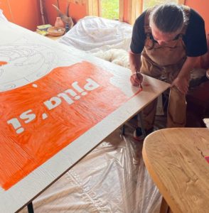 Lorne Julien working on mural for ISANS