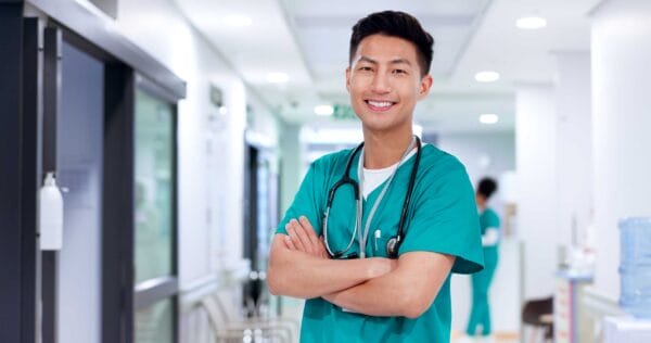 A smiling Asian man who works as a nurse