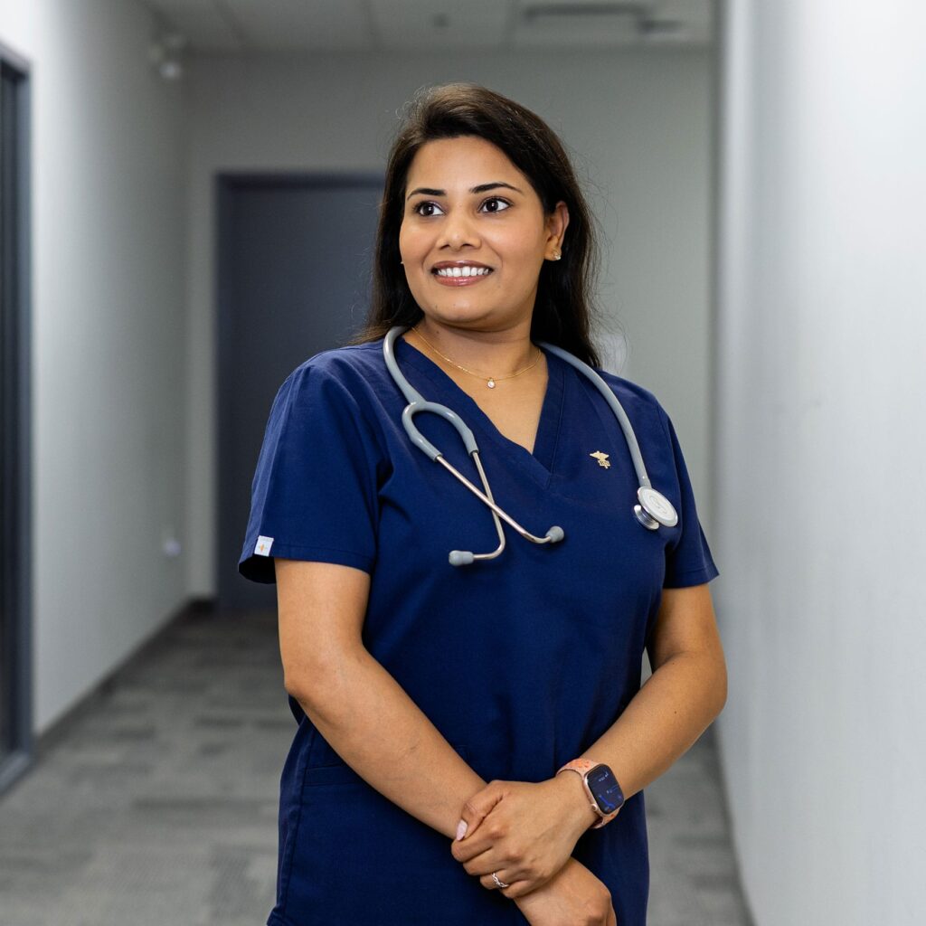 A female nurse wearing blue scrub