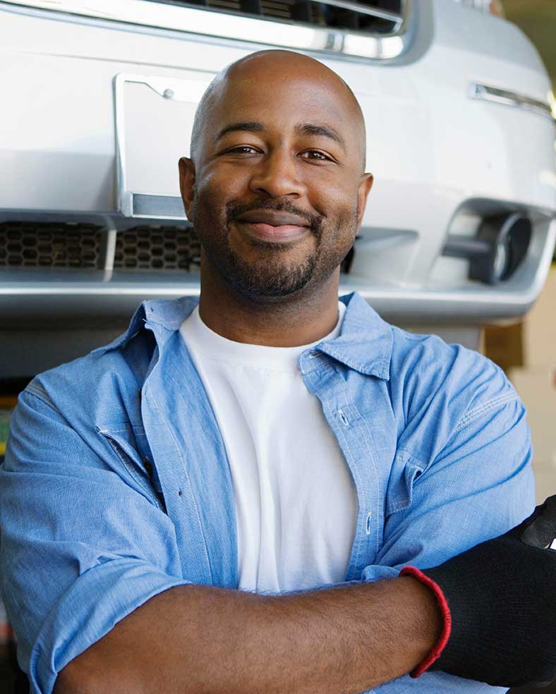 Smiling immigrant male mechanic