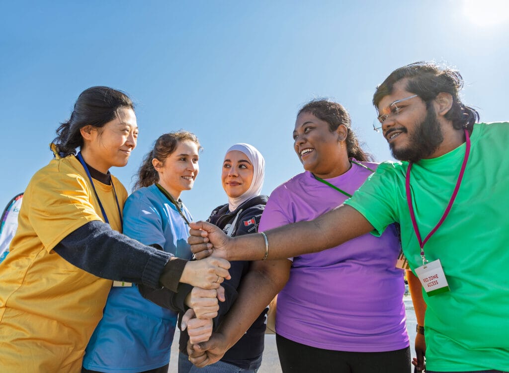 ISANS staff, clients, and volunteers working as a team