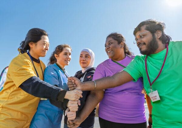 ISANS staff, clients, and volunteers working as a team