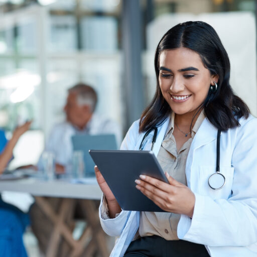 Hospital doctor and Indian woman on tablet for medical analysis research and report in meeting Healthcare clinic and female nurse on digital tech for wellness app online consulting and service