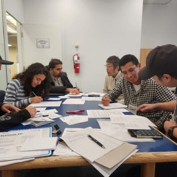 newcomers discussing with each other during the Conversation Circle program