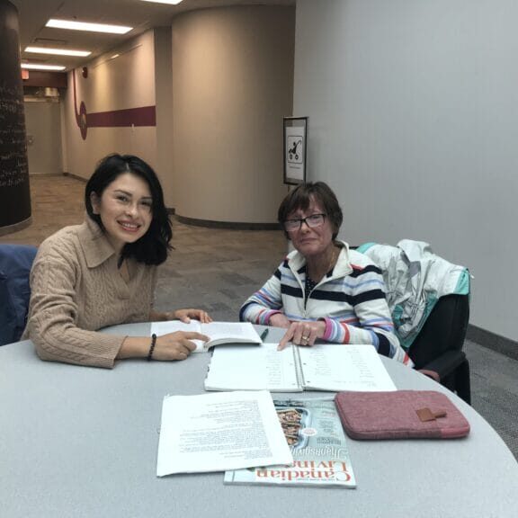 EAL Volunteer tutor with a client