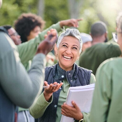 A newcomer immigrant talking to a group of people during a community event