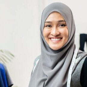 Asian muslim woman designer in her tailor shop