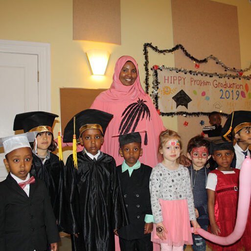 A group of graduates gather with one of the instructors