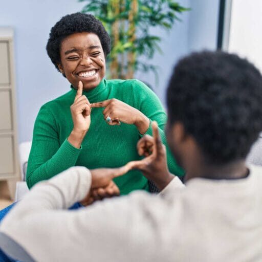 2 people communicating using sign language