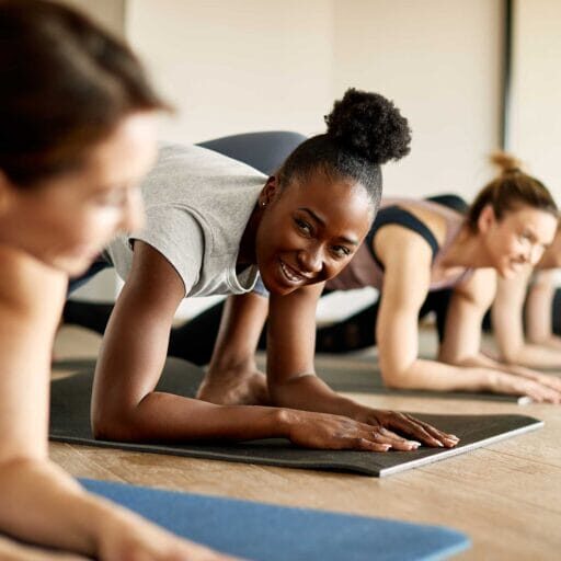 Multiethnic group of women enjoying yoga together