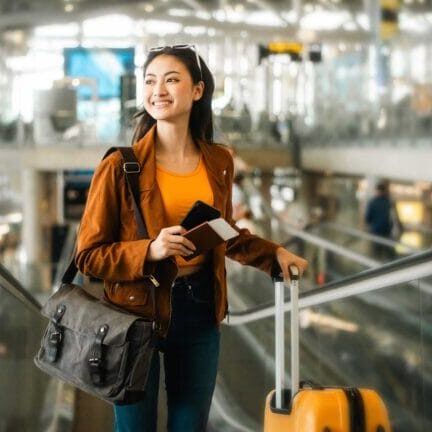 An immigrant woman smiling in the airport