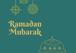 A text Ramadan Mubarak written on top of a teal background with a gold line art representing a mosque