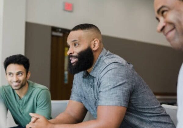 Three immigrant men attending the mental health program