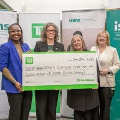 TD cheque presentation with senior leadership team