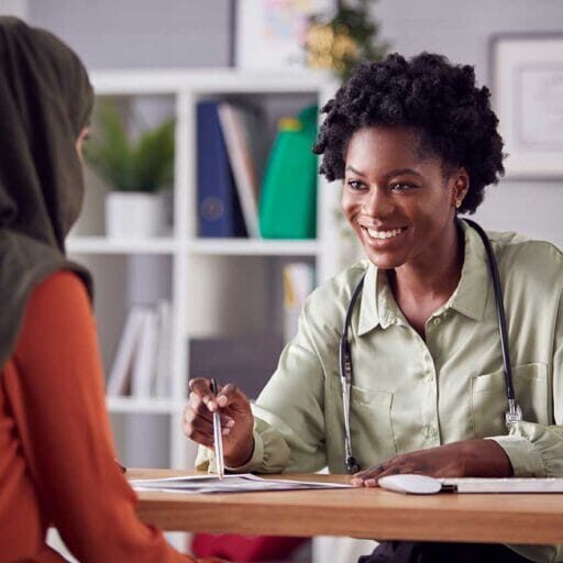 A newcomer female doctor talking to a patient