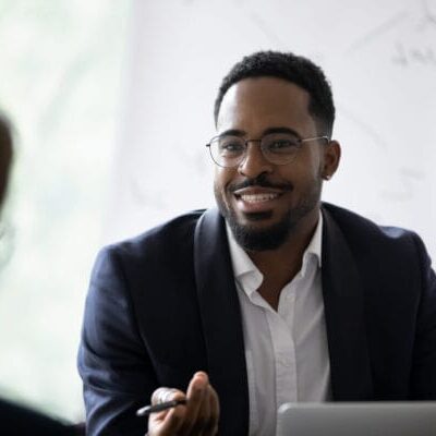 immigrant entrepreneur discussing with his business mentor