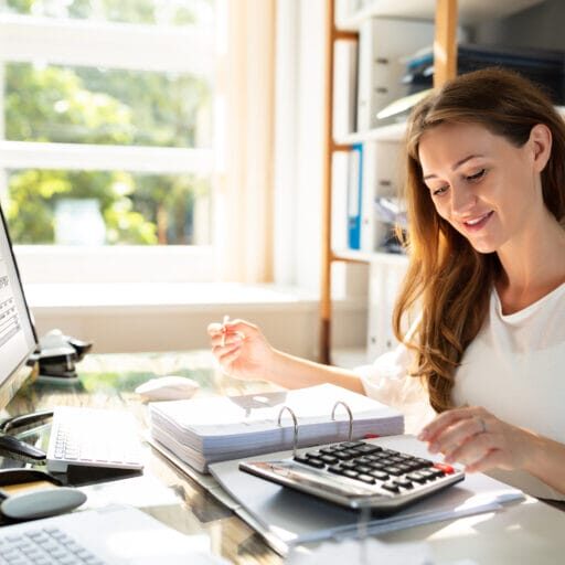 An internationally trained female accountant calculating the bill