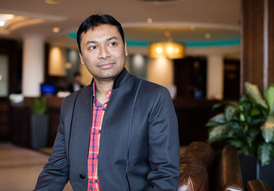 A male immigrant wearing smart casual