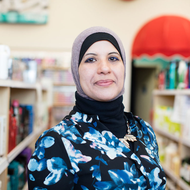 A muslim immigrant woman smiling