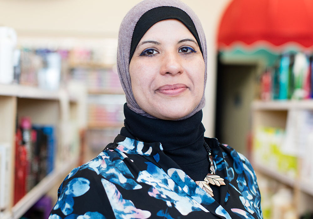 A muslim immigrant woman smiling